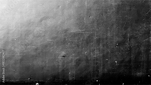 Monochrome grunge background with scratches and halftones showcasing a textured surface for creative design elements.