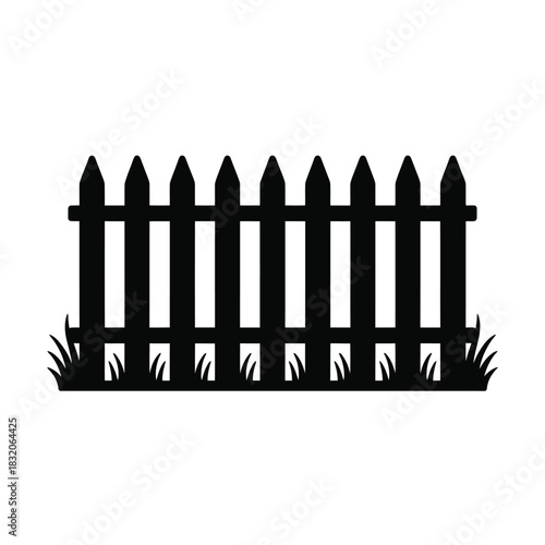 Black silhouette of a wooden picket fence with grass