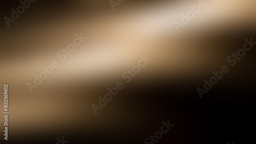 Abstract blurred background with black and light brown spots.