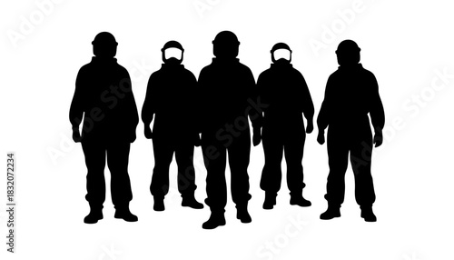 Silhouette of five people wearing helmets and protective gear standing