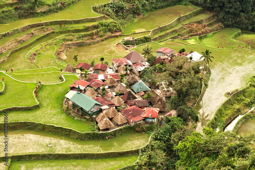 View of the small village of Bangaan surrounded by rice terraces, fields around it, close to Banaue, Luzon, Philippines