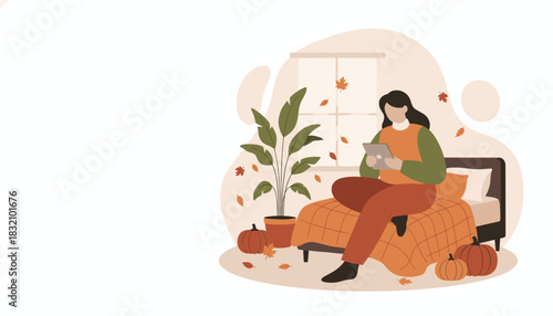 Cozy autumn leisure Woman using tablet on bed surrounded by pumpkins and fall leaves