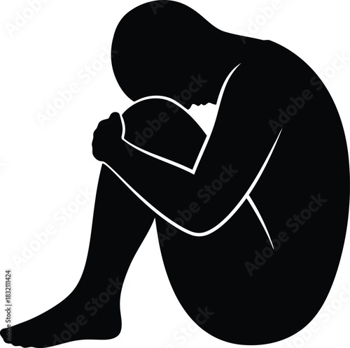 Silhouette of person in fetal position sadness