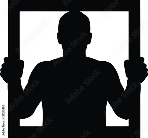 Silhouette man trapped behind bars