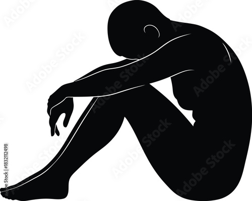 Silhouette of person in fetal position conveying despair