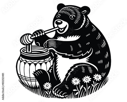 A black bear sits on grass with small flowers, happily eating honey from a pot using a wooden dipper