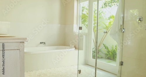 Featuring built-in alcove bathtub gleaming with chrome faucet in home bathroom, showing plush rug