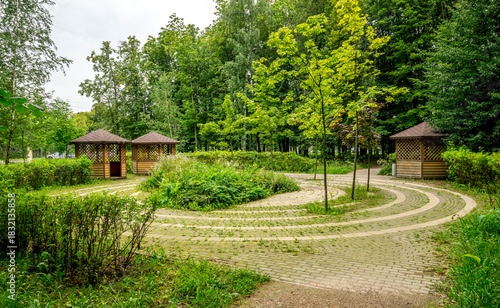 Peaceful Garden With Winding Brick Path And Gazebos In Victory Park On Poklonnaya Hill, Moscow, Russia, 10 August 2025