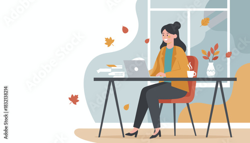 Woman works remotely on a laptop in a cozy autumn office enjoying coffee and productivity