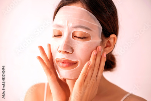 Woman Applying Hydrating Sheet Mask for Skincare Treatment