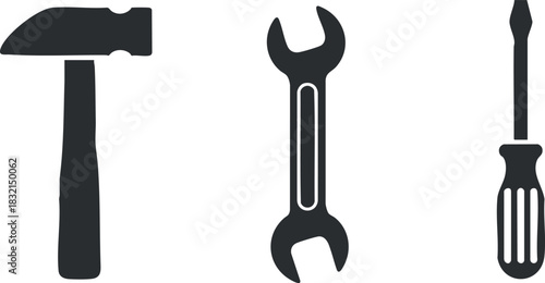A collection of a hammer, wrench, and screwdriver in black silhouette vector style, ideal for repair and construction projects