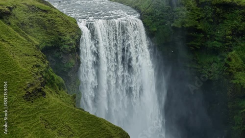 Skogafoss Waterfall with Mossy Cliffs Iceland