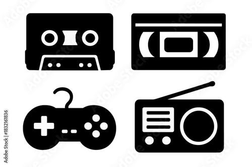 Set of four retro media and entertainment silhouettes: cassette tape, VHS, radio, and video game controller