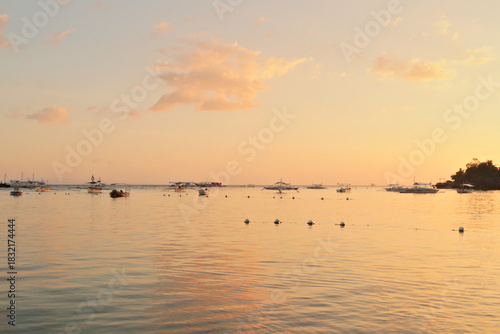 View over the water after sunset at Alona Beach, Panglao Island, Bohol Island, Philippines
