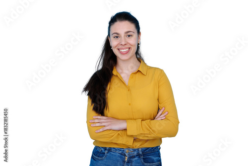 Confident young woman smiling with arms crossed, wearing yellow shirt and blue jeans, transparent background