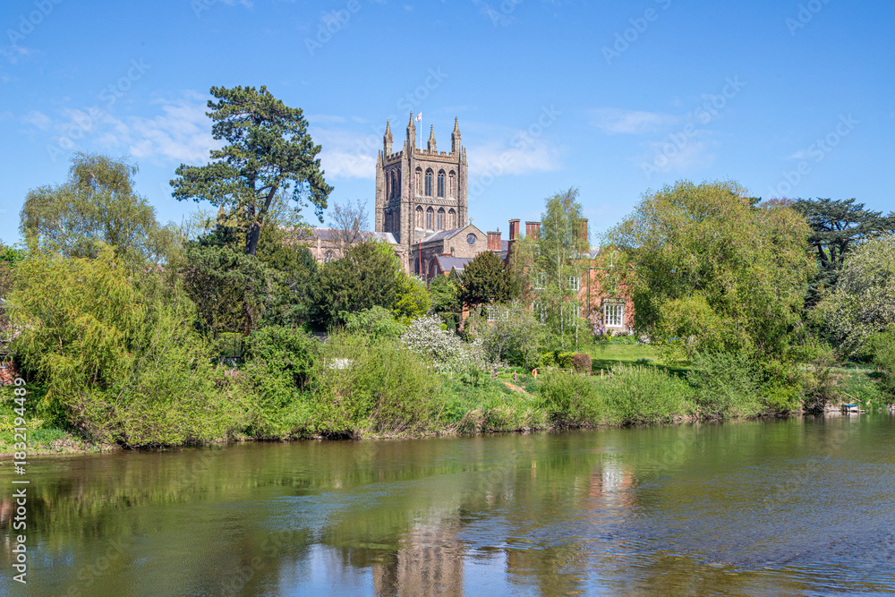 Fototapeta premium Hereford Cathedral viewed across the River Wye on Easter Sunday, Hereford, Herefordshire, England UK