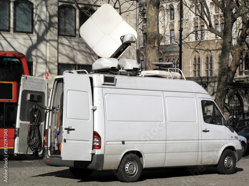 Outside broadcast mainstream white van media vehicle broadcasting for a television news channel in London England UK,  global communication stock photo image