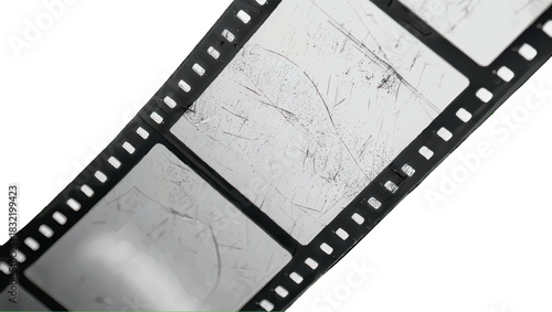 Close-up of a film strip with scratches on a white background.