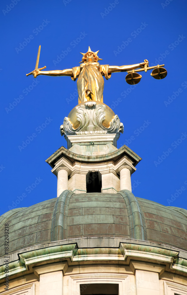 Fototapeta premium Lady of Justice of the Central Criminal Court fondly known as the Old Bailey in the city of London England UK, scales of justice stock photo image