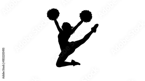 A cheerleader midjump holding pompoms in silhouette