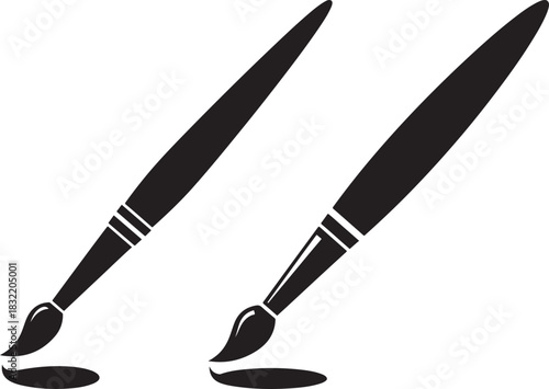 Two classic paint brushes creating splashes of color silhouette