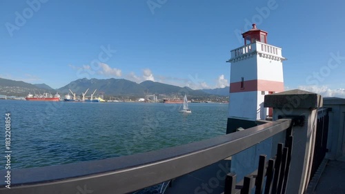 Sailboat Brockton Point Burrard Inlet 4K UHD. Brockton Point in Vancouver at the east end of Stanley Park on Burrard Inlet. A sailboat departing Vancouver harbour. British Columbia, Canada. 4K, UHD.
