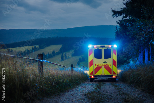 Ambulance car of emergency medical service on mountain road. Themes rescue, urgency and health care.