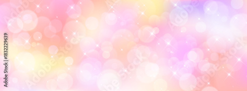 Unicorn bokeh background with glitter and rainbow gradient pattern. Soft pastel yellow, purple and pink colors with sparkling stars in magical atmosphere for fantasy fairy tale or dreamy girly design