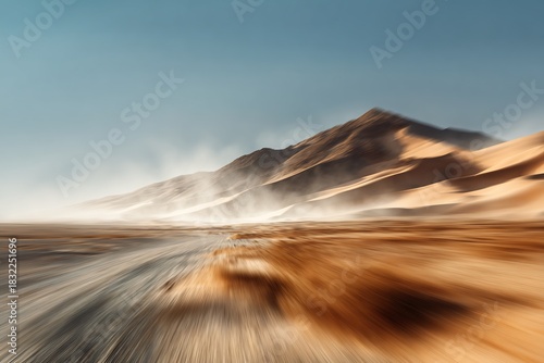 Fototapeta Naklejka Na Ścianę i Meble -  Motion blurred desert landscape with sand dunes and a hazy sky in a dry arid environment view