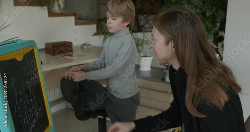 Male Teacher Gives Music Lesson for a Child. Man is Teaching Kid to Play Musical Instrument. 4K 10-bit