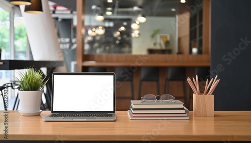 Wallpaper Mural Workplace Still Life: A modern workspace with a laptop, plant, and office supplies. The image is a visual representation of a workspace and a modern design. Torontodigital.ca