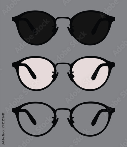 An empty frame is decorated with two glasses in black and white