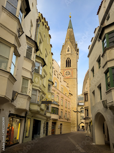 Beautiful curved streets, a church tower and old buildings as seen in the old town area of Bressanone/Brixen in Italy