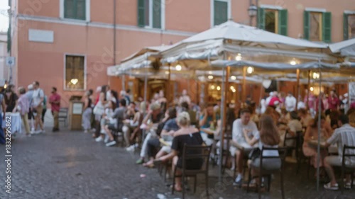 Wallpaper Mural Defocused outdoor rome street cafe scene with shallow bokeh and soft blur, warm tones and umbrella canopies; background backplate copyspace calm. Torontodigital.ca