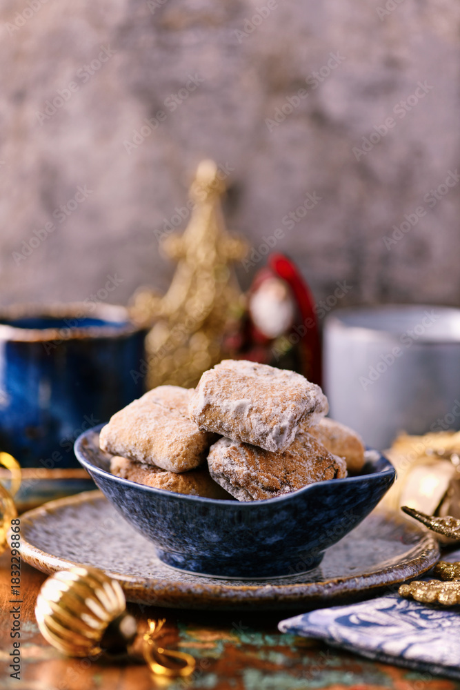 Fototapeta premium Traditional christmas cookies in a bowl on a rustic wooden background. Soft focus. 