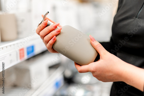 Woman Choosing Liquid Soap Dispenser