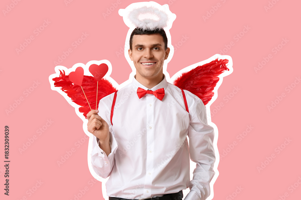 Obraz premium Young man dressed as Cupid with paper hearts on pink background. Valentine's Day celebration