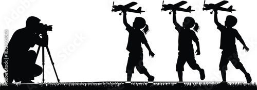 Childhood silhouette, toy airplane walk, kids in line, outdoor play, photographer capturing moment, grassy field, black vector, playful scene