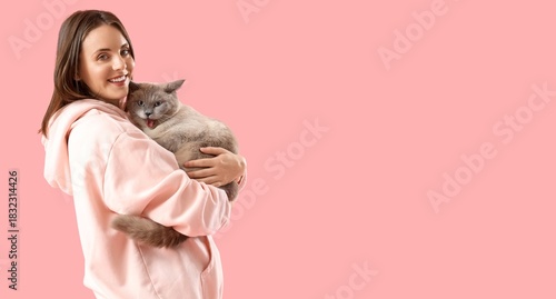 Happy young woman holding c...