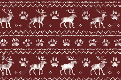 Knitted winter pattern with reindeer and paw prints