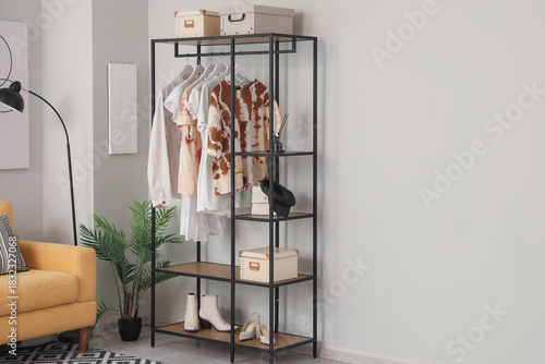 Shelving unit with clothes ...
