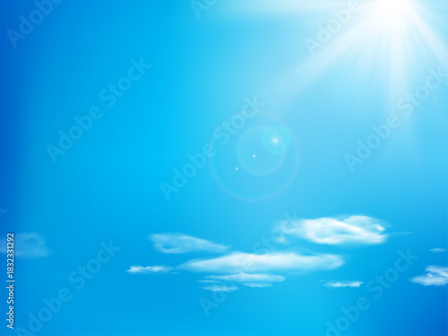 Bright Blue Sky with Sunlight and Soft Clouds on a Clear Sunny Day