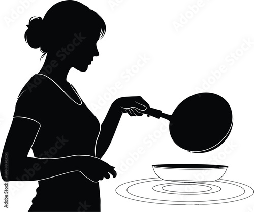 Silhouette of woman cooking with pan on stove top