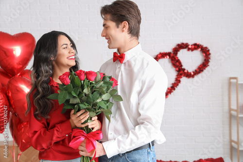 Happy young couple celebrat...