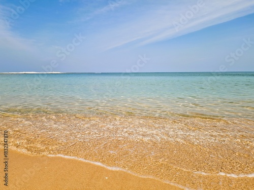 clear water, beach and blue sky