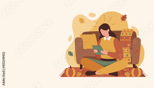 Digital leisure Woman uses a tablet in a warm cozy living room decorated for autumn