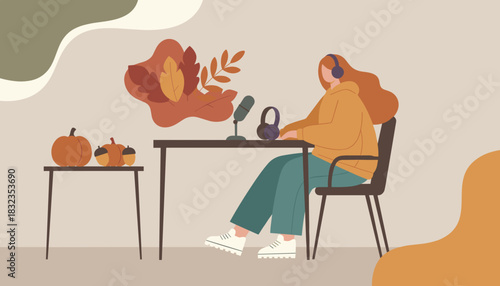 Woman recording an autumn podcast broadcast with microphone and headphones in a cozy fall setting