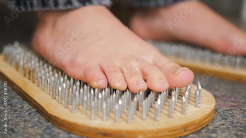close-up of a woman's feet standing on a board Sadhu