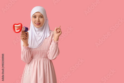 Young Asian Muslim woman wi...