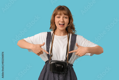 Beautiful young woman point...